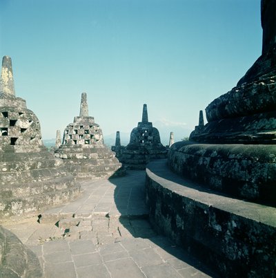 View of the uppermost circular terrace surrounded by latticed stupas or dagobs, erected c.800 AD by Unbekannt Unbekannt